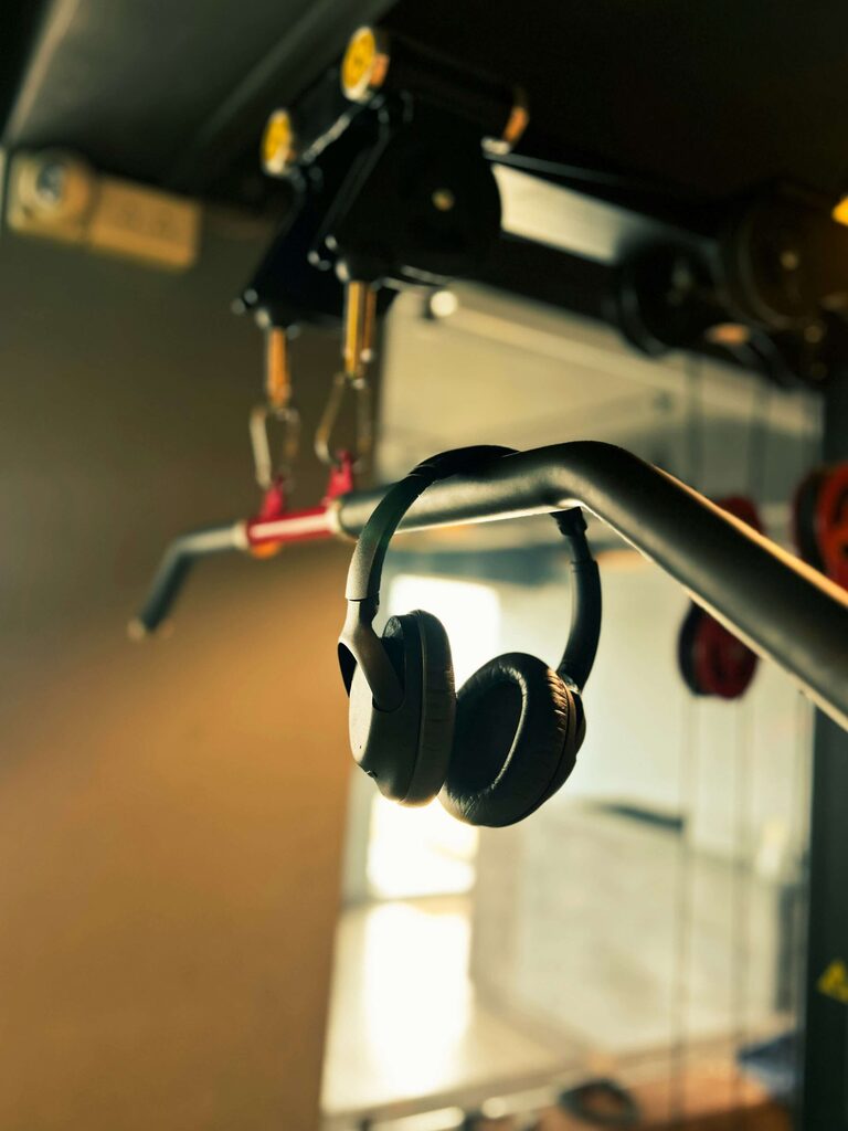 Headphones resting on gym equipment