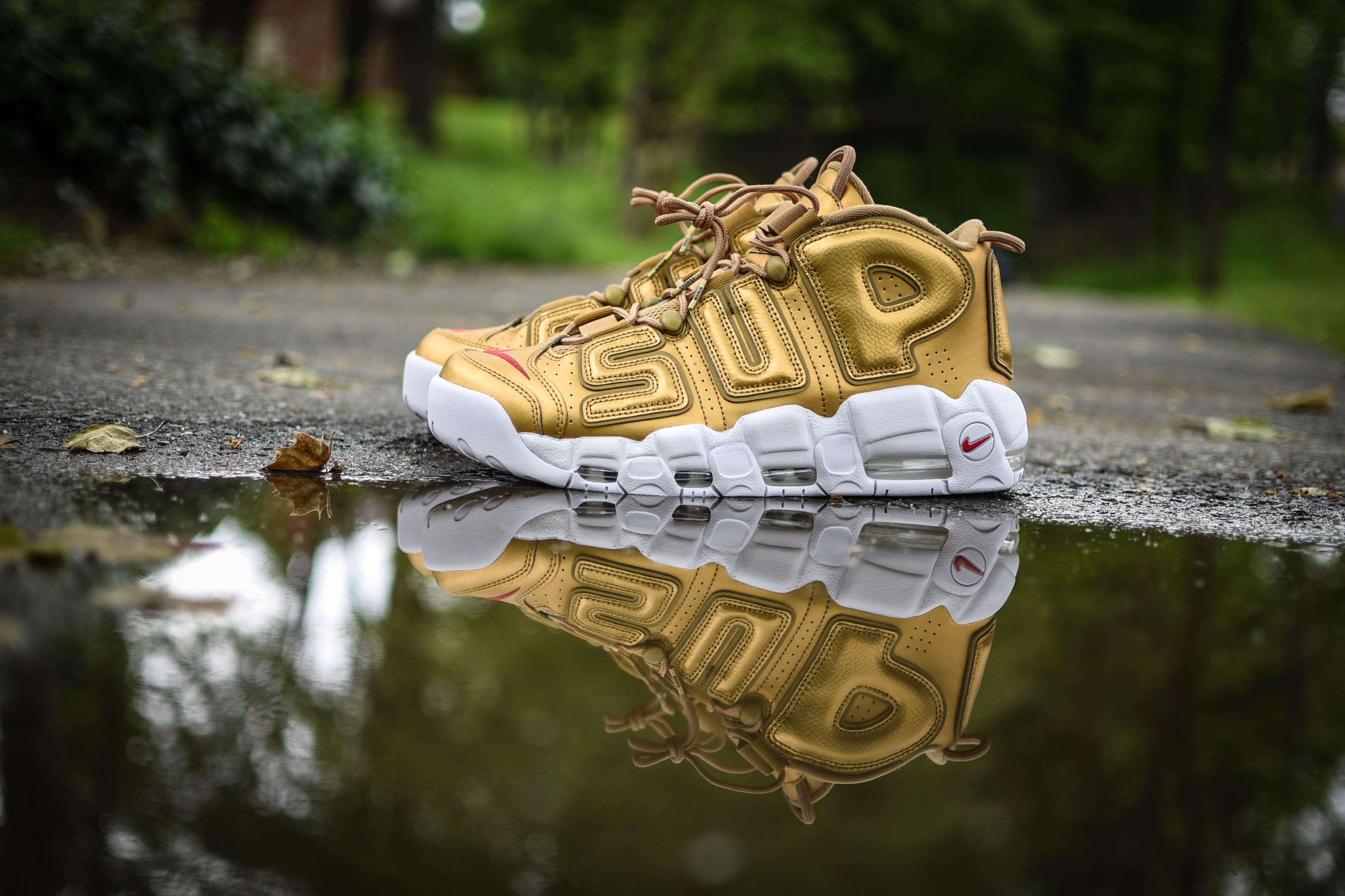 Nike shoe reflected in puddle