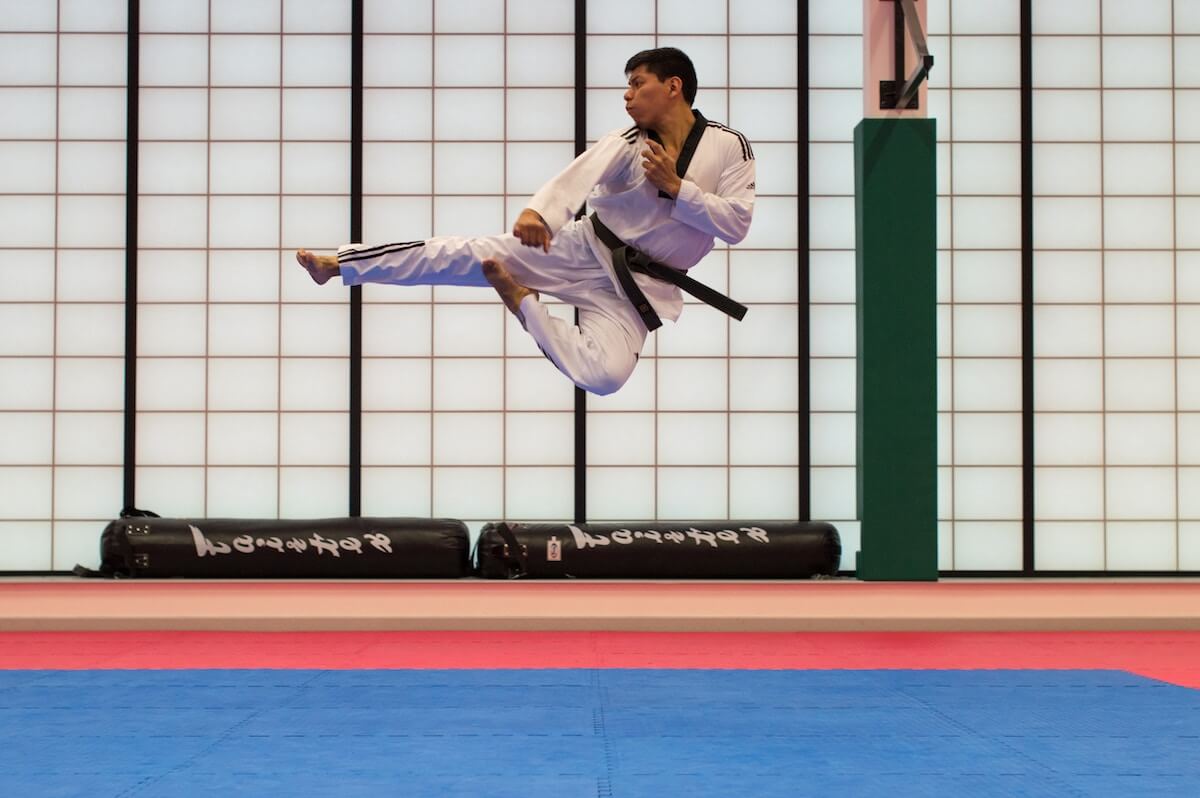 Karate practitioner doing a high kick