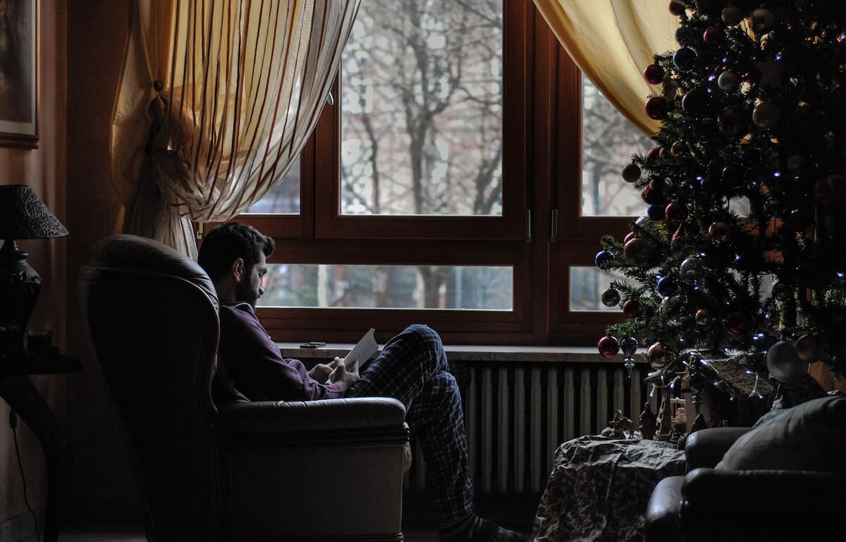 Man reading on armchair